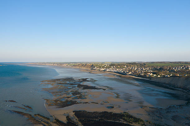 istock Clifftop village overlooking Gold Beach coastline 2254981010