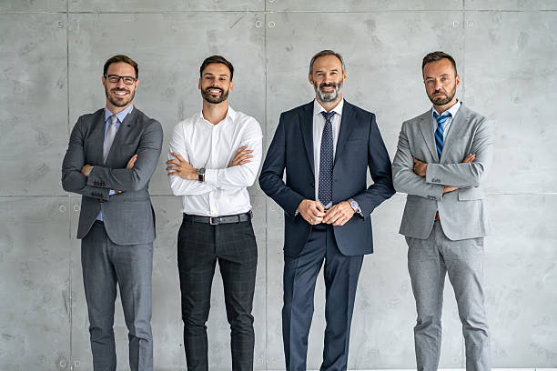 istock Group of Professional Men in Smart Suits at Workspace 2254983194