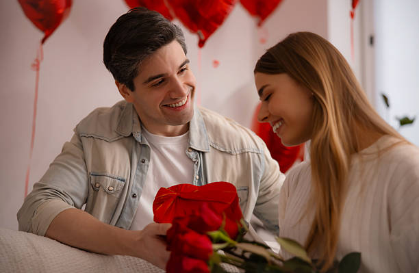 istock Cheerful young woman laughing during a romantic surprise. 2254984868