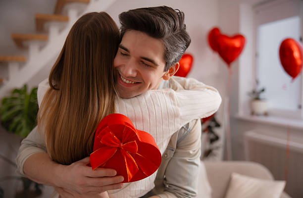 istock Man Hugging Woman With Heart Gift Box 2254984882