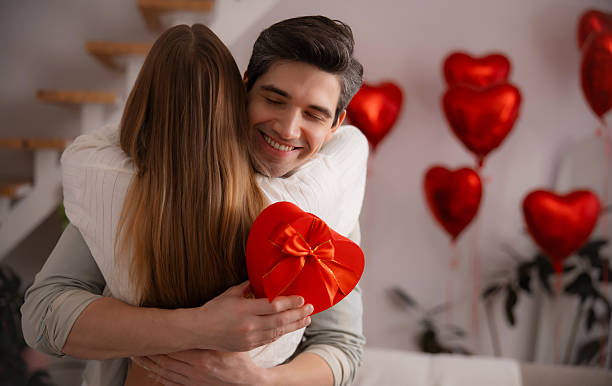 istock Happy Couple Embracing on Valentine's Day 2254984893