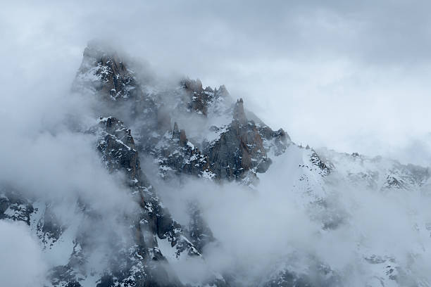 istock Misty peaks of Aiguille du Midi in dense cloud 2254990714