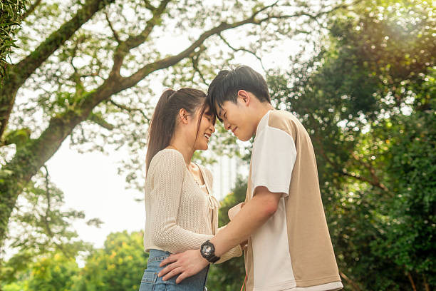 istock couple forehead touch with love expression, nuzzling on date 2254990888