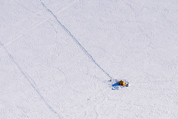 istock Lone yellow tent on snowy alpine plateau 2254991004