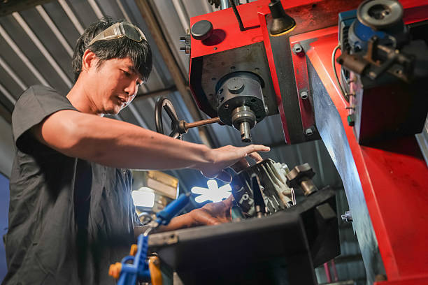 istock Machinist operating cnc machine workshop industrial process indoor environment close-up view precision engineering 2254992323
