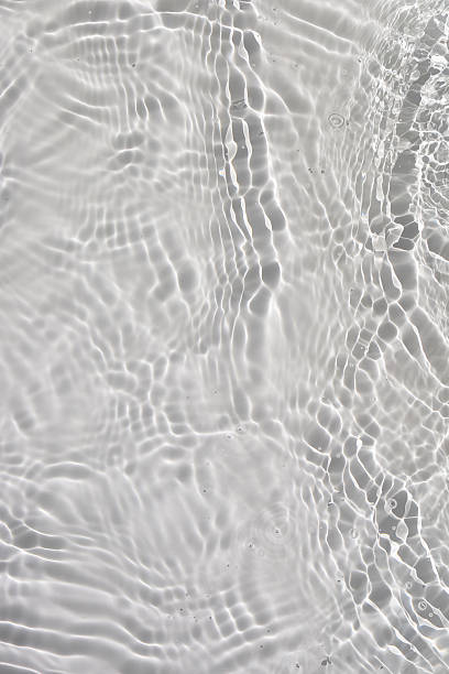 istock Soft ripples on the surface of clear water. 2254992677