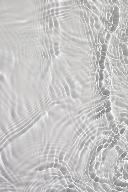 istock Soft ripples on the surface of clear water. 2254992798