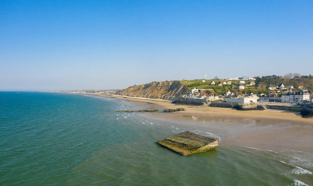 istock Wide sandy beach and cliffs at Arromanches-les-Bains 2254995479