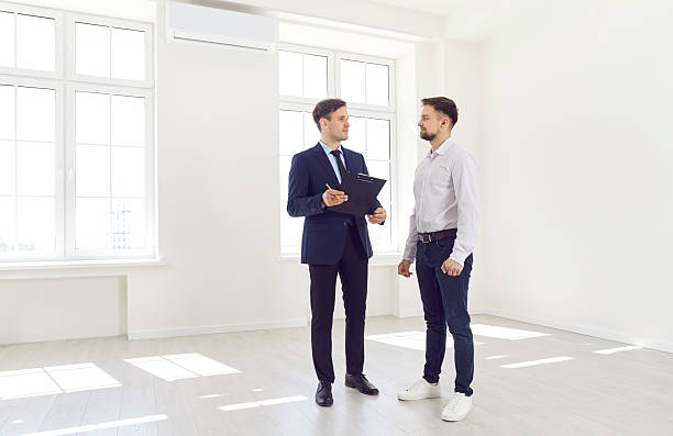 istock real estate agent Consulting Client On New Property Purchase 2254996654