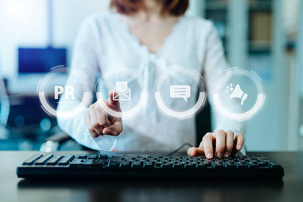 istock PR, Public relations concept. hands using laptop and tablet with public relations icon for communication advertising marketing strategy. with Ads and sales 2254998871