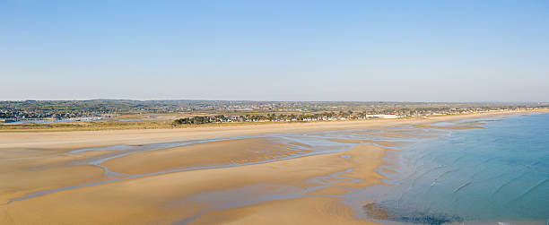 istock Vast tidal sand flats and calm blue sea view 2254999210
