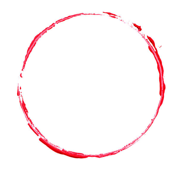 Red brush stroke circle frame in lipstick isolated on white background