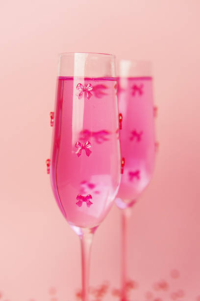Sparkling pink beverages with sweet bow accents create a festive and loving atmosphere.