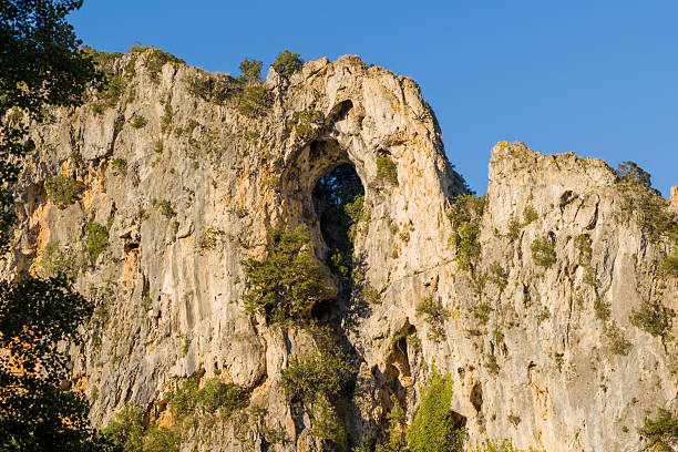 istock Sunlit rocky arch formation in Ardeche cliffs 2255009087