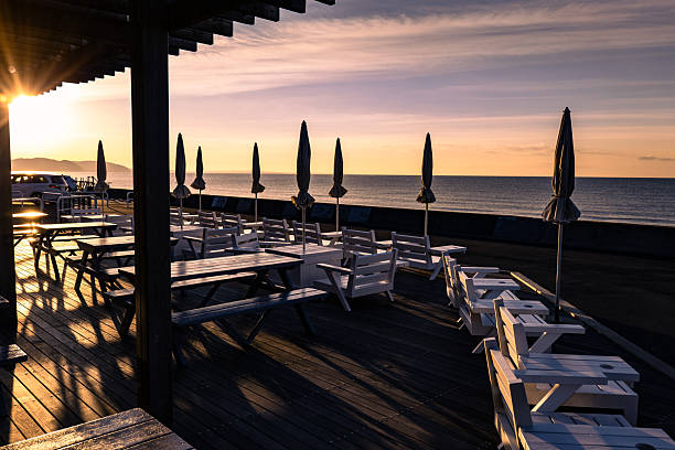 istock Sun-drenched beachside cafe terrace at sunrise in seaside 2255010803
