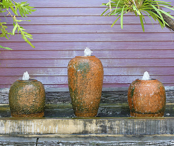 A row of Greek urns, focus on foreground.