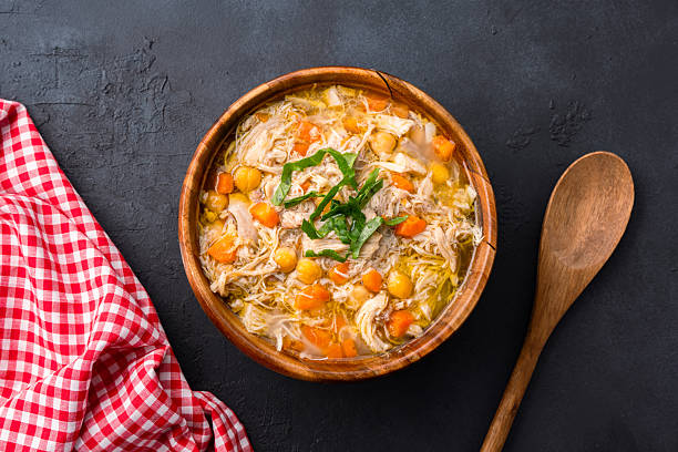istock Delicious chicken soup with chickpeas served on an old black stone table. 2255012163