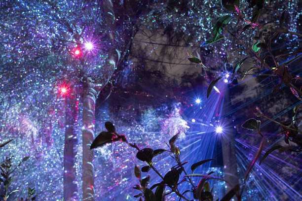istock Abstract festive background created with long exposure light effects, colorful beams, glowing particles and magical holiday atmosphere 2255013000