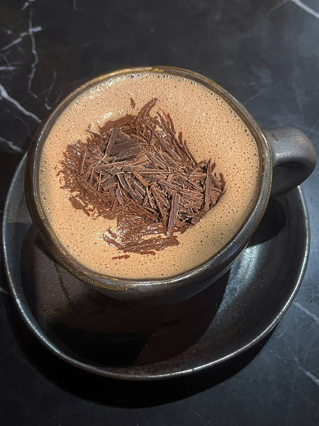istock Chocolate hot drink with shaved chocolate garnish in ceramic cup, cozy warm beverage and rich texture 2255016623