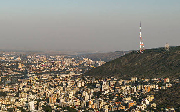 Tbilisi skyline with Mtatsminda ridge and TV tower. Aerial view