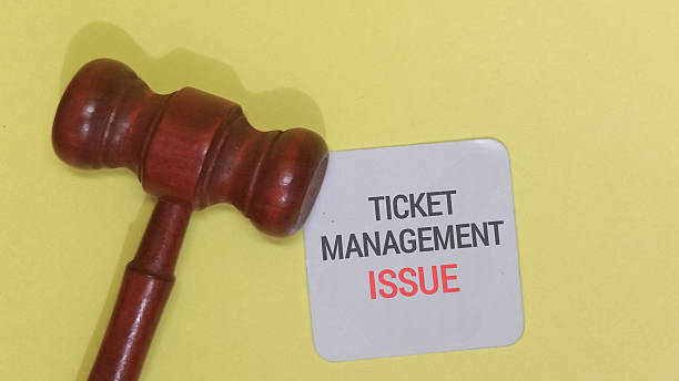 istock Gavel and ticket management issue on yellow background 2255017941