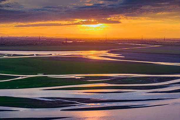 Beautiful sunset, wetland dried-up river, texture overlooking