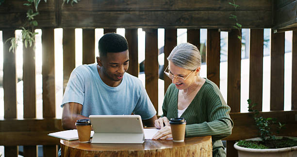 istock Tablet, discussion and business people in cafe with teamwork for creative project with plan. Collaboration, cappuccino and magazine editor with manager for article publishing with digital technology. 2255021278