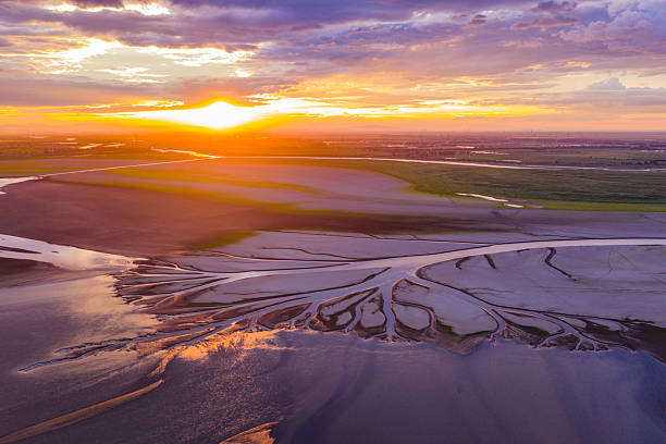 istock Beautiful sunset, wetland dried-up river, texture overlooking 2255021545