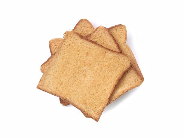 Fresh toasted whole wheat bread slices isolated on white background. Top view, Perfect for healthy breakfast, nutrition, and bakery-themed concepts