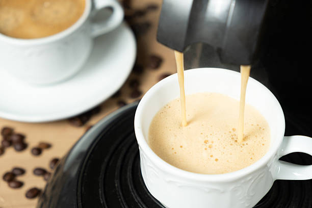 Process of making coffee using a pod machine with two streams of beverage