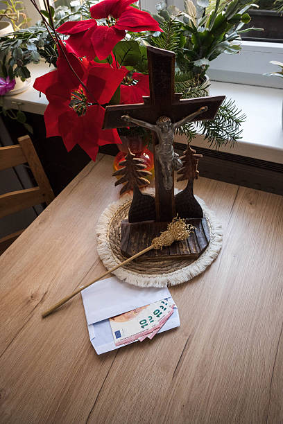 Home altar prepared for the priest's visit after Christmas carols. Donation for the church in an envelope.