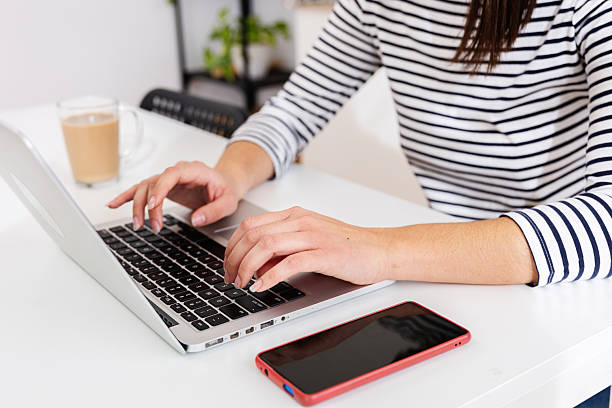 istock Close up female hands typing on computer in the office. 2255026308