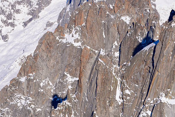 View to the north face of the Mont Blanc (4810 m) with mountaineers on the normal route and the top. Taken from the Aiguille du Midi (Mont Blanc Massif, France).