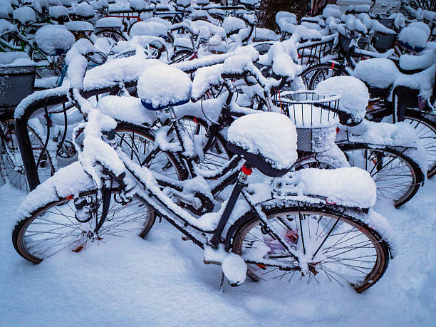 Stockholm, Sweden - March 9, 2023: Snowed up and abandoned bicycle in the tourist island in the center of Stockholm
