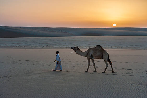 Beautiful boy in Dubai desert. Vacation mood.