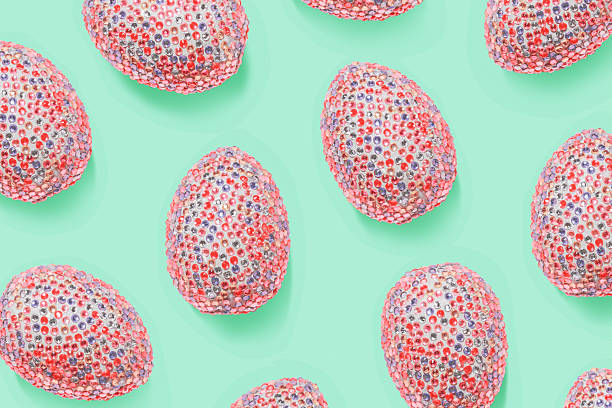 Ornate easter eggs in colorful sequins as minimal trend repeat pattern pastel mint color. Pop art still life photo with sparkling rhinestones pink eggs, spring easter holiday concept, modern design