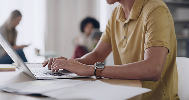 istock Business person, laptop and hands for document, article comparison or review in creative office. Journalist, typing or tech in agency for website update, topic research or paperwork for planning 2255038947