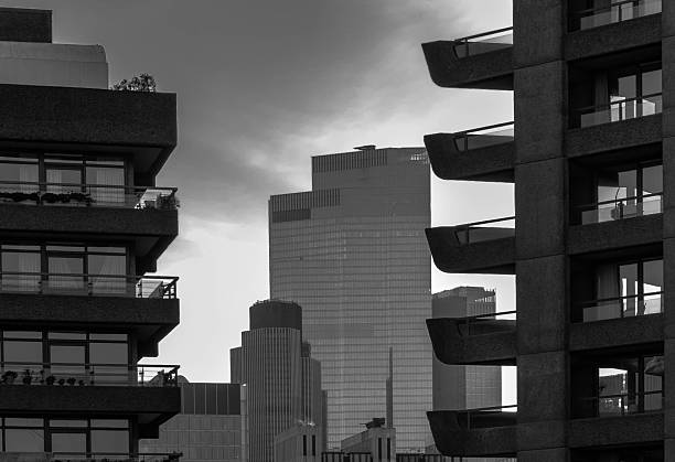 The Barbican is celebrated as an icon of Brutalist architecture, characterized by its raw concrete construction, bold geometric forms, and a focus on functionality. The design features a complex of residential towers, walkways, and public spaces, creating a \