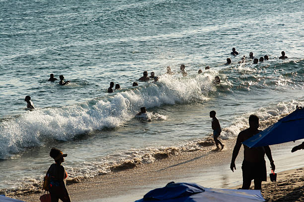 Young friends playing on the beach