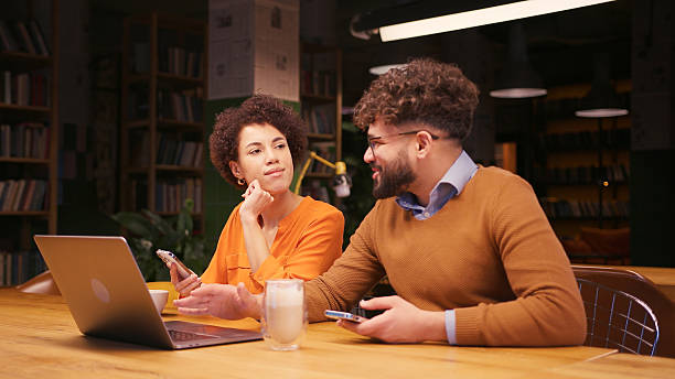 istock Successful colleagues sitting on table in modern office using laptop, working, planning project 2255047378