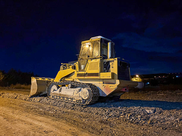 istock Bulldozer in a construction site at night 2255047641