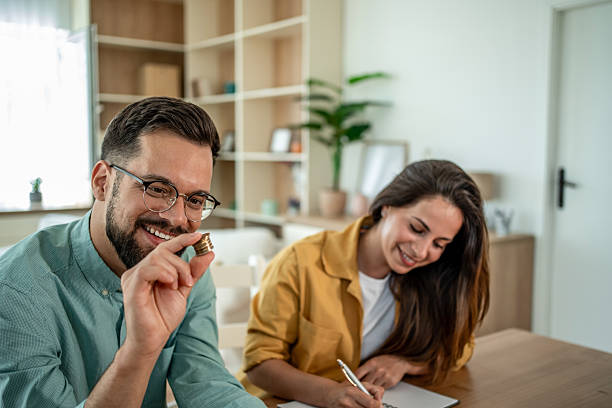 istock Couple saving money and planning budget at home 2255050131