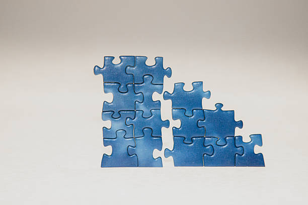 istock Two sets of jigsaw puzzles in the making 2255052734