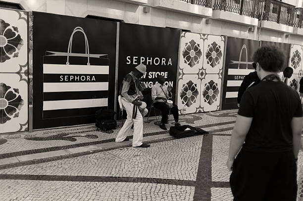 Lisbon, Portugal - July 19, 2025: Street musicians perform at the Rua Augusta street in Lisbon downtown.