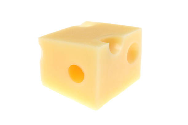 Cube of delicious cheese isolated on white