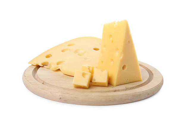 Cut fresh delicious cheese isolated on white