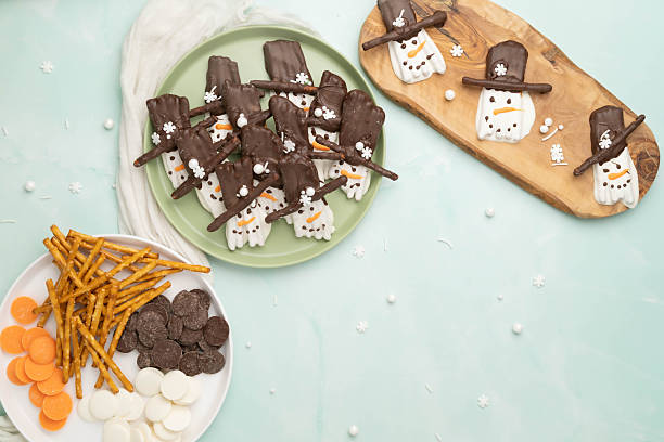Fun, easy, kid friendly, pretzel stick snowmen with snowflake shaped candies.