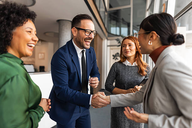 istock Business people shaking hands and celebrating partnership success 2255058629