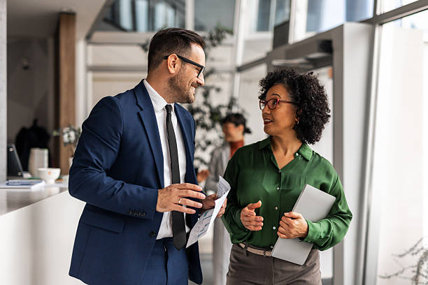 istock Business partners collaborating and discussing in modern office 2255058778