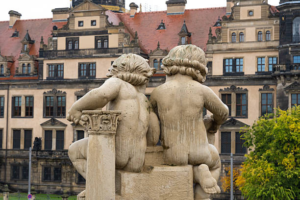 Saxon architecture in Dresden. Saxon Palace Zwinger. Sculpture decorating the exterior of the courtyard. Dresden, Germany - 05.20.2019